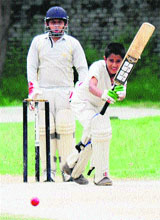Players in action during a cricket match between the Chandigarh Cricket Association and the Mohali Cricket Association at Guru Nanak Public School in Sector 36, Chandigarh, on Saturday.