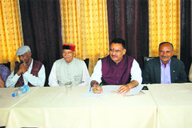 Ganesh Joshi, MLA, Mussoorie (second from right), addresses meidapersons in Mussoorie on Friday.