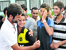 Fans line up to congratulate Parvez Rasool, the first cricketer from Kashmir selected to represent the country at the international level, at his home at Bijbehara in Anantnag on Saturday