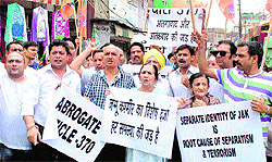 BJP activists hold a protest in Jammu on Saturday