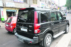 A vehicle with tinted glass plies on a road in Jammu. 