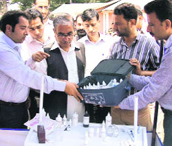 Minister for Agriculture Ghulam Hassan Mir inspects a kit in Srinagar on Saturday. 