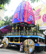 Artists give finishing touches to Lord Jagannaths chariot in Kolkata on Saturday.