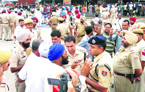 SAD workers stage a dharna at Chandigarh Chowk in Nawanshahr on Saturday.