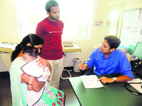 A doctor advises a patient at the medical camp organised by Max Hospital. 