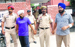 The accused in police custody.