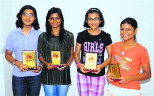 Winners of the Women Chess Championship strike a pose with their prizes at Sector 44 in Chandigarh on Sunday.