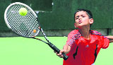 Rishab Sharda plays a shot during tennis tournament in Mohali on Sunday.