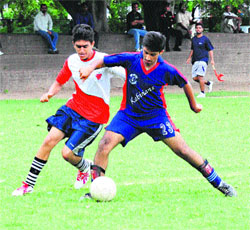 Players in action during a football match at the Sports Complex, Sector 42, in Chandigarh. 