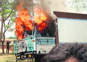 A truck carrying cattle set on fire by villagers on the Bahl-Bhiwani road on Sunday
