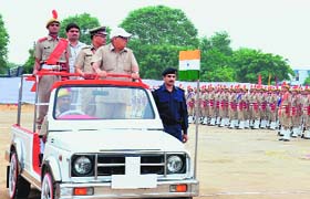 Chief Minister Bhupinder Singh Hooda inspects the passing-out parade of police recruits at Bhondsi in Gurgaon on Sunday
