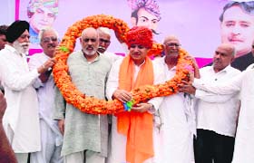 Supporters garland Rao Inderjit Singh in Hisar on Sunday
