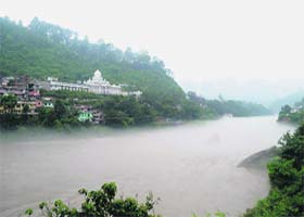 The swollen Beas under a layer of mist in Mandi on Saturday