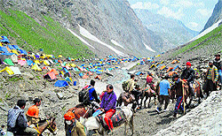 Pilgrims heading for the Amarnath cave shrine near Dhumail in Sonmarg on Sunday