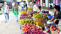 Vendors sell fruits and vegetables in Jammu on Sunday