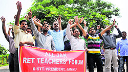 Members of RET Teachers Forum protest in support of their pending demands in Jammu