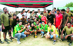 Players of the Army team with the winning trophy in Batote on Sunday