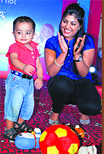 A child with her mother at a show at Mother's Pride Playway School in Ludhiana