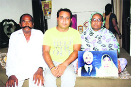 Lekhu Ram with family members of missing BSF sepoy Surjit Singh in Faridkot on Sunday. 