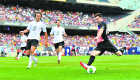 Lionel Messi shoots against the Rest of the World during the Messi and Friends charity exhibition match in Chicago on Saturday.