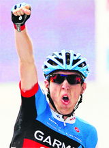Garmin-Sharp team rider Daniel Martin celebrates his win in the ninth stage on Sunday.