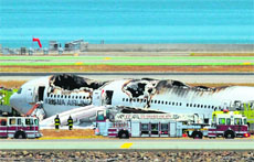 An Asiana Airlines Boeing 777 on the runway at the San Francisco airport after crash landing on Saturday. 