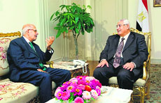 Egypt's interim President Adly Mansour (R) with Mohamed ElBaradei in Cairo on Saturday.