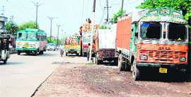 Parking of heavy vehicles on the Batala road near Amritsar leaves the stretch congested. 