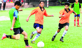 Players in action during a match between SGGS Khalsa School and Shishu Niketan School at the Sector 17 football stadium in Chandigarh on Monday.