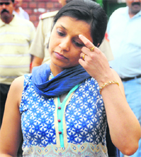 Victim Rajesh Goyal's wife Sonia comes out of the court.