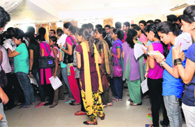 Students queue up at the enquiry counter of the Panjab University in Chandigarh on Monday.