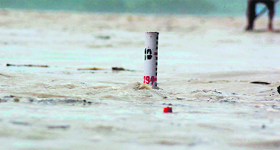 The Ganga waters touch the danger level following heavy rains in the catchment areas of Haridwar on Monday.