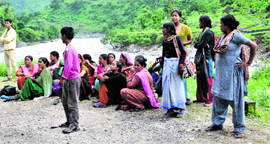 Villagers wait for relief supplies in the Baram valley of Pithoragarh district.