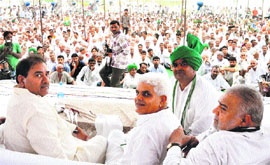 INLD leader Abhey Chautala along with other leaders at a public meeting in Jahangirpur village in Jhajjar.