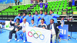 Members of Indian Women Kabaddi Team pose with the International Olympic Committee (IOC) flag after their victory at the 4th Asian Indoor and Martial Arts Games at Incheon in South Korea.     