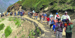 Pilgrims pass through Baltal on their way to the Amarnath cave shrine on Monday. 