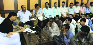 Baldev Raj Sharma, MLA, Reasi, addresses a public grievances camp in Reasi on Monday.