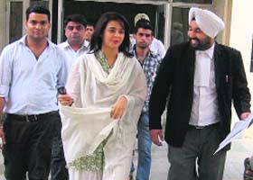 Actor Surveen Chawla comes out of a court in Sangrur on Monday