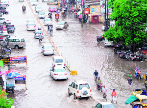 Commuters have a tough time following heavy rain in Amritsar on Tuesday.