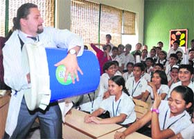 A scientist from Ukraine conducts an interesting experiment during a session at Hallmark Public School in Panchkula on Tuesday