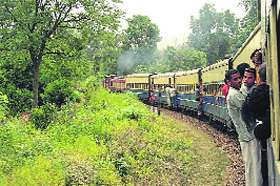 An overloaded train on the Pathankot-Jogindernagar track.