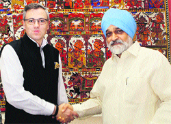 Chief Minister Omar Abdullah with Deputy Chairman of Planning Commission Montek Singh Ahluwalia in New Delhi on Tuesday.