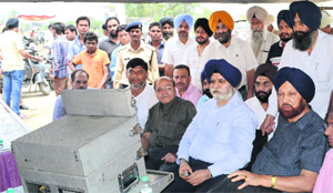 Mayor Harcharan Singh Gohalwaria, accompanied by former Mayor Hakam Singh Giaspura, inspects sewer cleaning work near Dhandari in Ludhiana on Tuesday. 