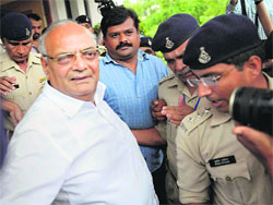 Former Madhya Pradesh Finance Minister Raghavji being arrested in connection with a case of sodomy in Bhopal on Tuesday .  PTI