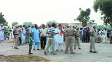 Police tries to disperse the protesters who were agitating against the school authorities.