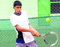 Digvijay Pratap returns a shot during a tennis match at Paragon School, Sector 71, in Mohali on Wednesday