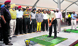 Gurinderjit Singh Sandhu, president of Chandigarh Golf Club, plays the inaugural drive at the new driving range in Chandigarh on Wednesday