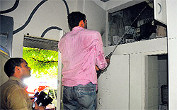 Firemen control the fire that broke out in a showroom due to short-circuit at Sector 17, Chandigarh, on Wednesday
