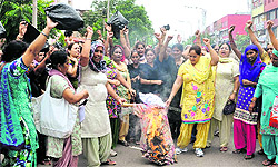 Aanganwadi workers protest outside the Deputy Commissioners office in Phase I, Mohali, on Wednesday