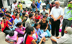 Students of Homeopathic Medical College, Sector 26, interact with the college authorities in Chandigarh on Wednesday